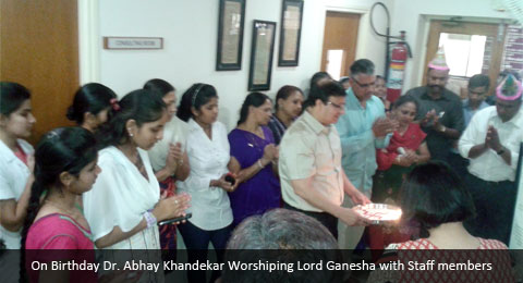 On Birthday Dr. Abhay Khandekar Worshiping Lord Ganesha with Staff members