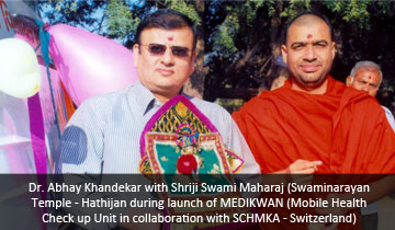 Dr.Abhay Khandekar with Shriji Swami Maharaj  (SwaminarayanTemple - Hathijan during launch of MEDIKWAN (Mobile Health Check up Unit in collaboration with SCHMKA - Switzerland)
